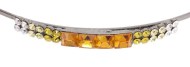 This metal headband decorated with Swarovski crystals measures approximately 0.1 inches thick at center. The ornamentation is on the side of band and about 2 inches by 0.25 inches. G2
