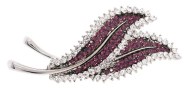 This SWAROVSKI CRYSTAL brooch measures approximately 2.0 inch wide and 0.8 inch high. 