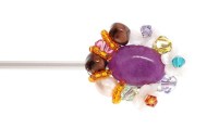 Metal hair stick decorated with a SWAROVSKI CRYSTAL on the of top is about 5.5 inches long totally. The ornamentation on the top is 1.0 inch by 1.25 inch. B1