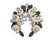 This SWAROVSKI crystal brooch measures approximately 1.5 inch wide and 1.5 inch high.