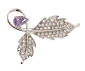 This SWAROVSKI crystal brooch measures approximately 2.0 inch wide and 1.5 inch high.
