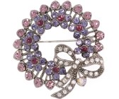 This crystal brooch measures approximately 1.75 inch wide and 1.75 inch high.