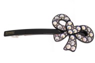 This plastic AZNAVOUR barrette in medium size measures about 4.25 inches wide and 1.75 inches high. The clasp on the back is about 3 inches long. P17