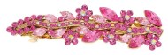 This medium size barrette decroated with SWAROVSKI crystals measures about 3.75 inches wide and 1.2 inch high. The clasp on the back is about 2.25 inches long. P2