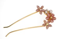 This hair stick decorated with crystal measures approximately 4.25 inches long. The top is about 2.25 inches by 1.5 inches. B5