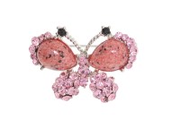 This crystal brooch measures approximately 1 inch wide and 2 inch high.