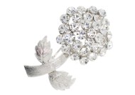 The crystal brooch is 2 inches by 1 inch