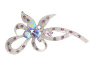 The crystal brooch is 2.5 inches by 1.5 inches