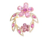 This SWAROVSKI brooch approximately measures 1.5 inch by 1.75 inch. 