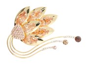 This SWAROVSKI brooch approximately measures 2.25 inch by 2.0 inch.