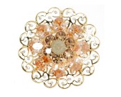 This SWAROVSKI  brooch approximately measures 1.75 inch by 1.75 inch.