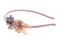 This headband decorated with a crystal measures approximately 0.25 in thick at center. The ornamentation is about 4.0 inches by 1.5 inches. G1