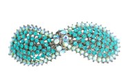 This medium size barrette is about 3.25 inches wide by 1.15 inches high. The clasp on the back is about 2.0 inches long. P9