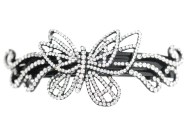 This medium size barrette decorated with tons of crystals measures about 3.75 inches wide and 1.5 inch high. The clasp on the back is about 2.5 inches long. P3