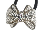 This ponytail holder is made with SWAROVSKI CRYSTAL and about 2.0 inches by 1.75 inches. T21