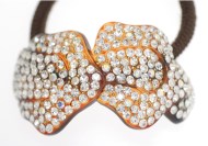This ponytail holder is made with SWAROVSKI CRYSTAL and about 2.25 inches by 1.5 inches. T22