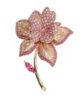 This SWAROVSKI CRYSTAL brooch in flower shape measures approximately 1.5 inch wide and 2.25 inch high.